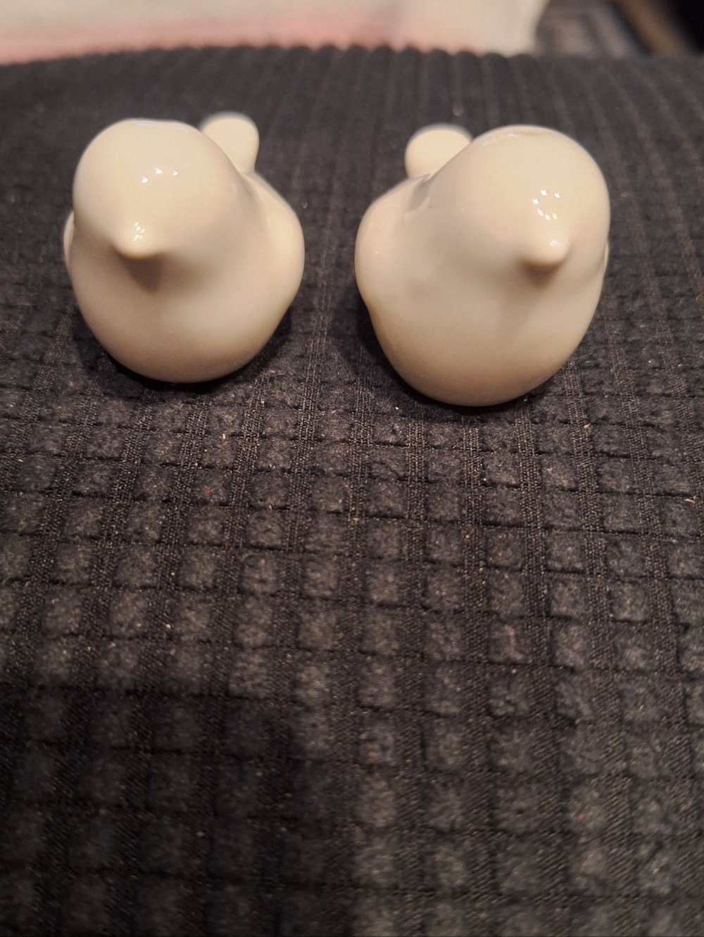 These petite, white ceramic bird figurines appear to be a pair of vintage-style